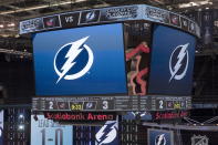 The scoreboard is shown after the Tampa Bay Lightning defeated the Columbus Blue Jackets in five overtimes in Game 1 of an NHL hockey Stanley Cup first-round playoff series, Tuesday, Aug. 11, 2020, in Toronto. (Frank Gunn/The Canadian Press via AP)