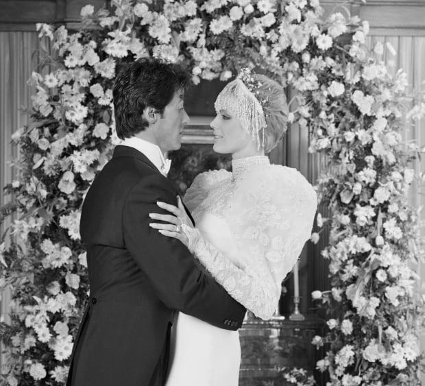 Sylvester Stallone and Brigitte Nielsen are photographed here immediately following their wedding ceremony at the home of Rocky producer, Irwin Winkler. A reception followed for <a href="https://parade.com/1045384/marynliles/family-quotes/" rel="nofollow noopener" target="_blank" data-ylk="slk:family;elm:context_link;itc:0;sec:content-canvas" class="link ">family</a> and close friends. Miss Nielsen and Mr. Stallone were filming "Cobra," after which they planned to go on a honeymoon.<p><a href="https://www.gettyimages.com/detail/515174696" rel="nofollow noopener" target="_blank" data-ylk="slk:Bettmann/Getty Images;elm:context_link;itc:0;sec:content-canvas" class="link ">Bettmann/Getty Images</a></p>