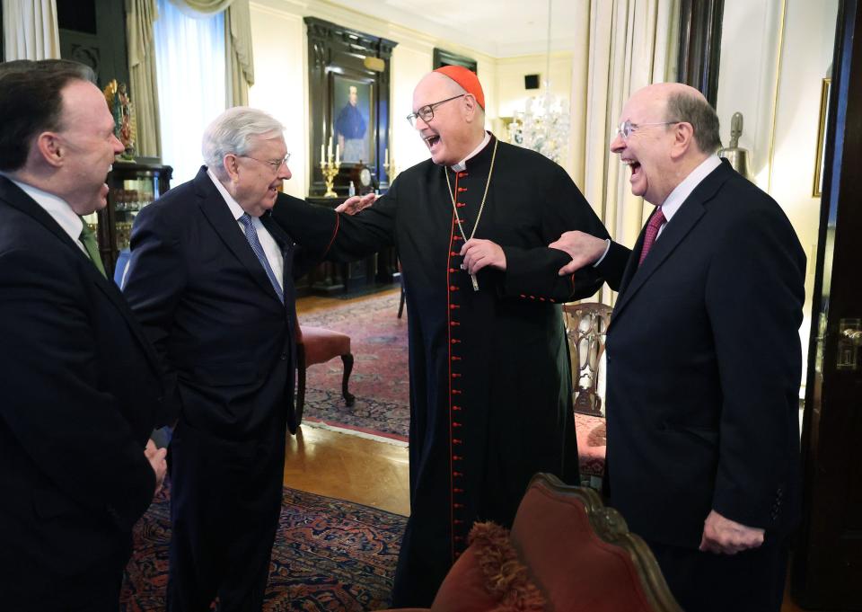 President M. Russell Ballard and Elder Quentin L. Cook laugh with Cardinal Timothy M. Dolan at St. Patrick’s Cathedral in March.