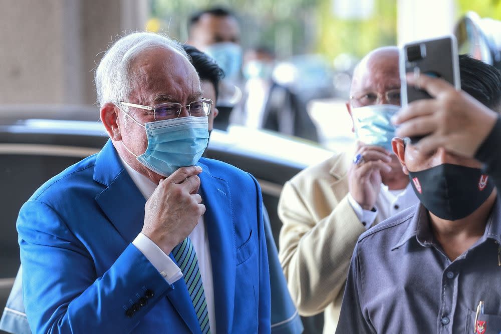 Datuk Seri Najib Razak asked if Tun Dr Mahathir Mohamad would be penalised for breaching the standard operating procedures, after saying he just paid RM3,000 today for two identical offences during his visit to a restaurant in Bukit Bintang last March. — Picture by Ahmad Zamzahuri