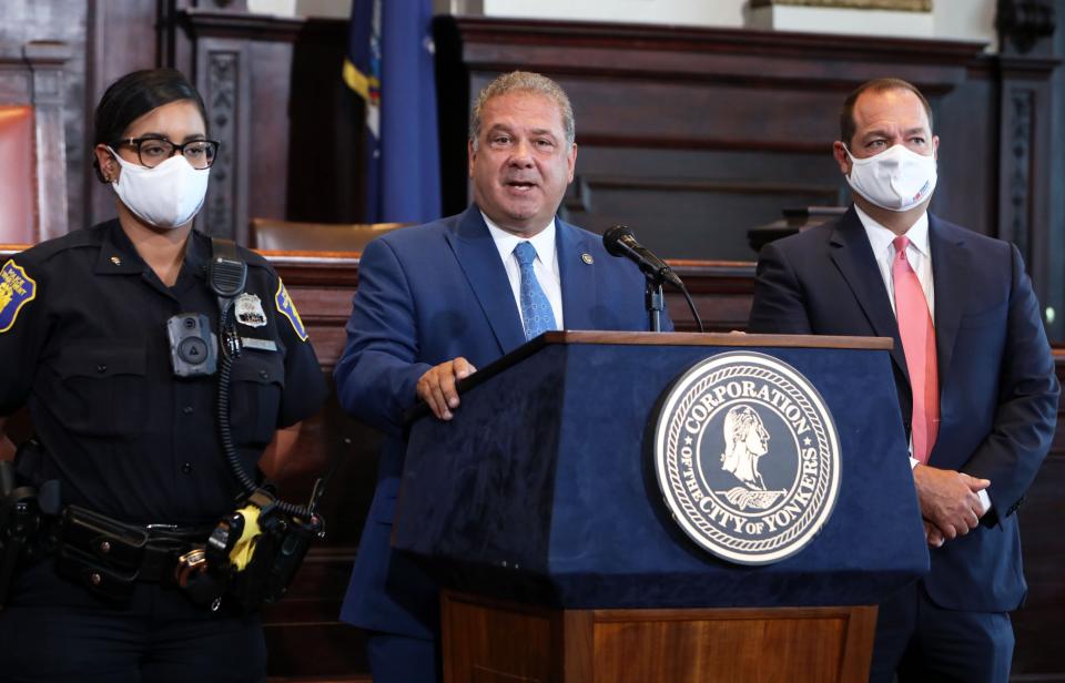 Mayor Mike Spano announces a three-month police body camera pilot program along with Commissioner John Mueller and Police Officer Nachyra Jimenez Aug. 18, 2020 in Yonkers City Hall.