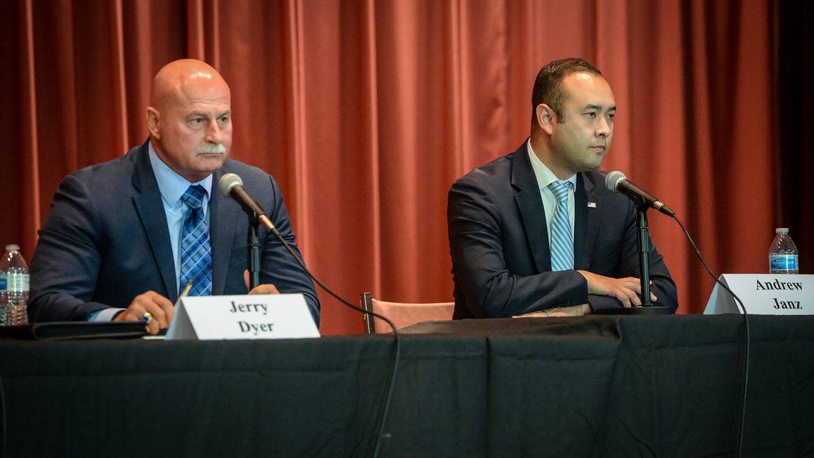 Fresno mayoral candidates Jerry Dyer, left, and Andrew Janz await questions during a debate held at St. Paul’s Methodist Church in Fresno on Saturday, Oct. 19, 2019.