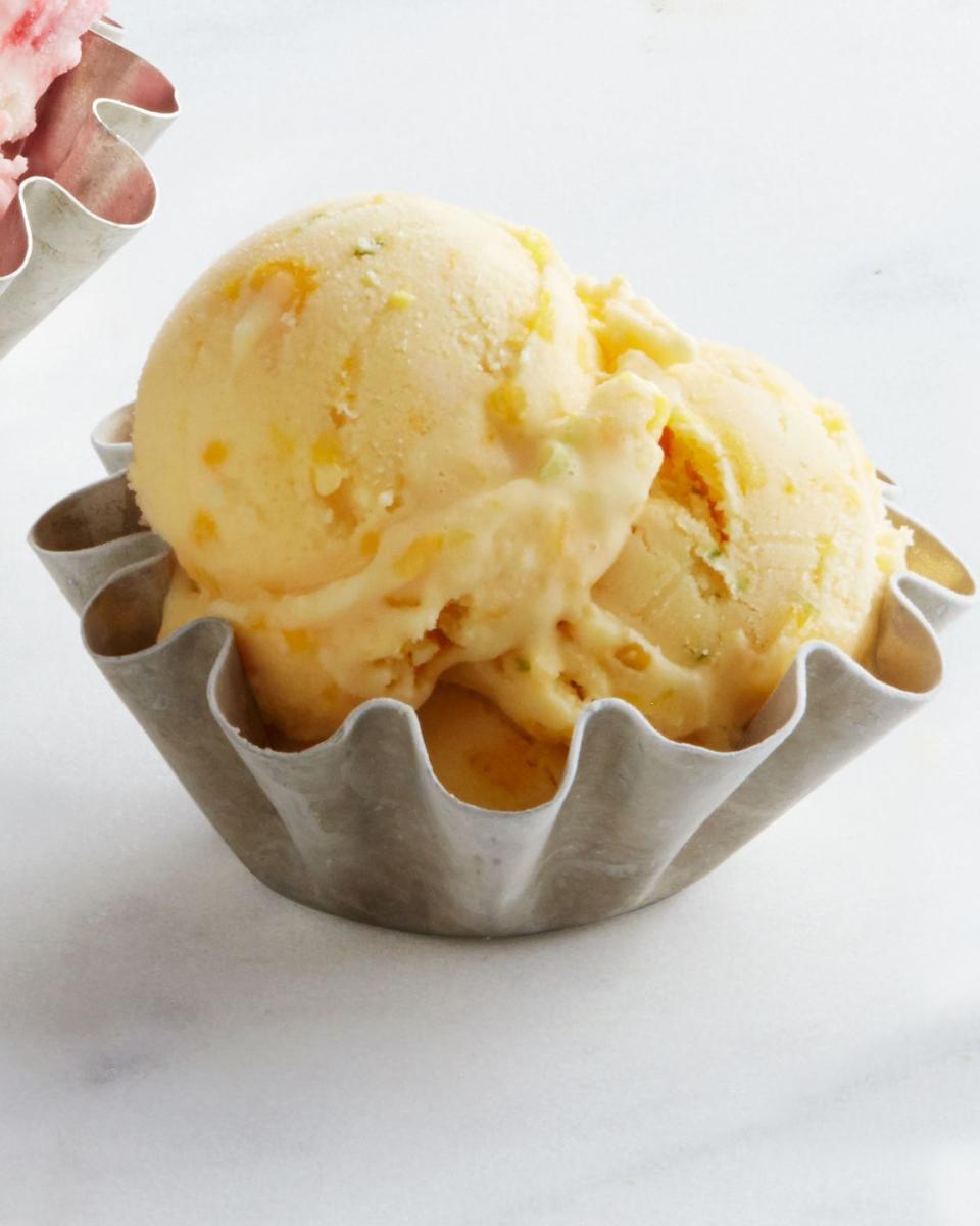 mango lassi swirl frozen yogurt in a small bowl