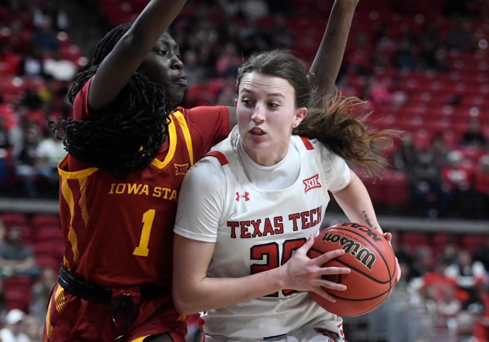 Texas Tech's guard Bailey Maupin (20), right, dribbles the ball against Iowa State, Saturday, Dec. 31, 2022, at United Supermarkets Arena. 