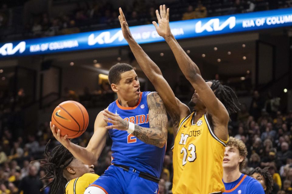 Florida's Riley Kugel, left, shoots over Missouri's Aidan Shaw, right, during the first half of an NCAA college basketball game Saturday, Jan. 20, 2024, in Columbia, Mo. (AP Photo/L.G. Patterson)