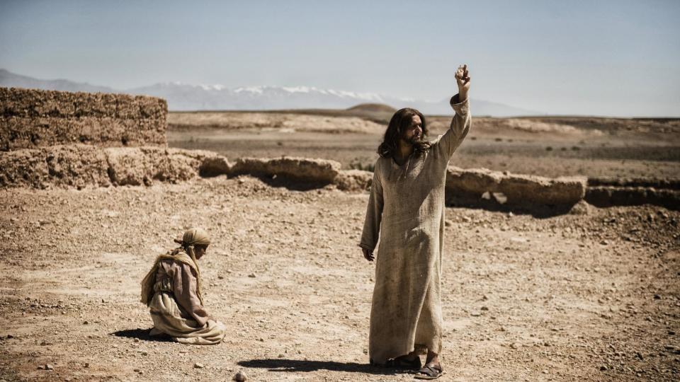 This publicity image released by History shows Diogo Morcaldo as Jesus, right, in a scene from "The Bible," premiering Sunday, March 3 at 8 p.m. EST on History. (AP Photo/History, Joe Alblas)