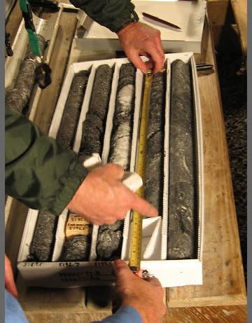 On site at the Chesapeake Bay Impact Structure, geologists examine and catalog core sections.