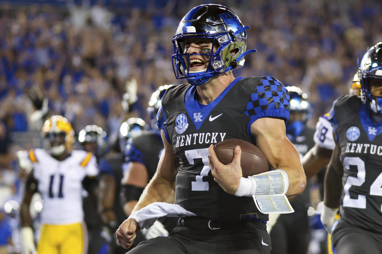 Kentucky quarterback Will Levis smiles as he scores a touchdown during the second half of the team's NCAA college football game against LSU in Lexington, Ky., Saturday, Oct. 9, 2021. (AP Photo/Michael Clubb)