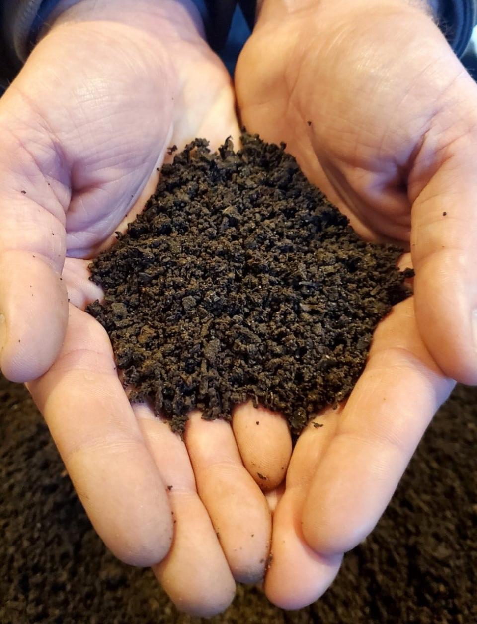 Cory Groshek holds the end product of his sifted compost Jan. 24.