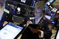 Trader John Panin works on the floor of the New York Stock Exchange, Thursday, July 18, 2019. U.S. stocks moved lower in early trading on Wall Street Thursday after Netflix reported a slump in new subscribers and dragged down communications companies. (AP Photo/Richard Drew)