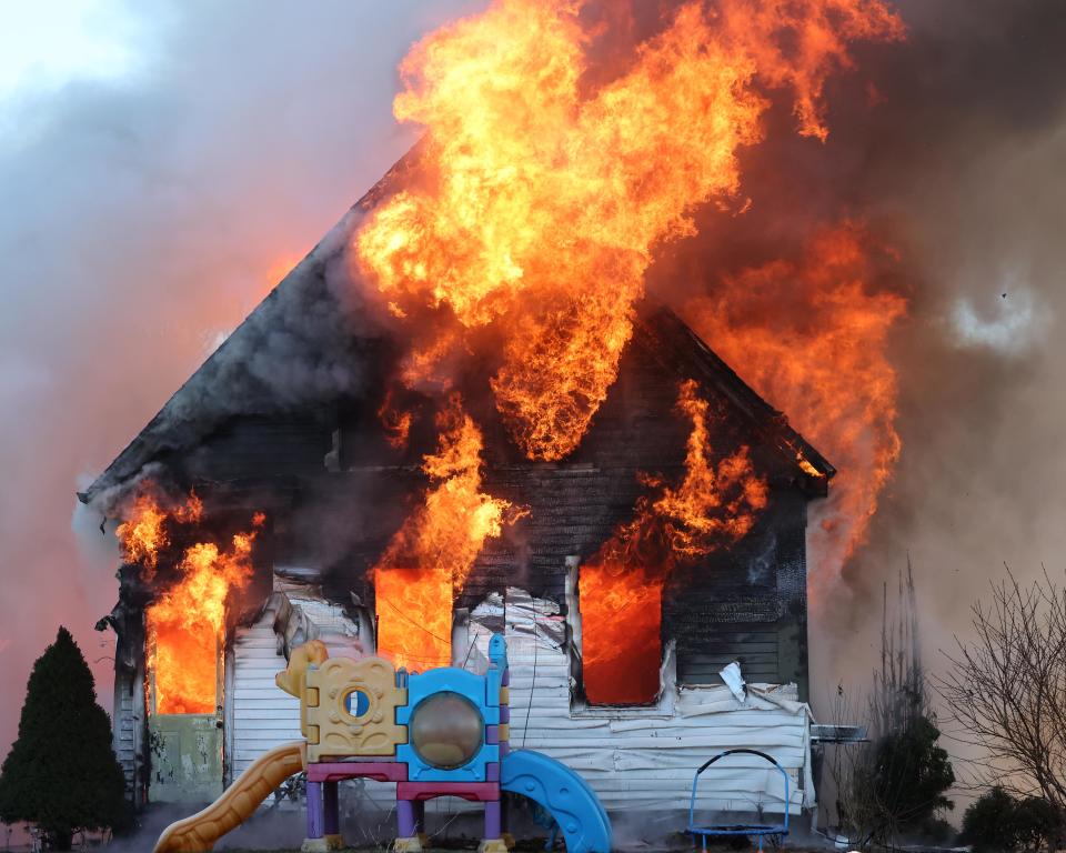 Firefighters from multiple communities battle a two-alarm house fire at 53 Old Bedford Road in East Bridgewater on Sunday, Feb. 4, 2024.