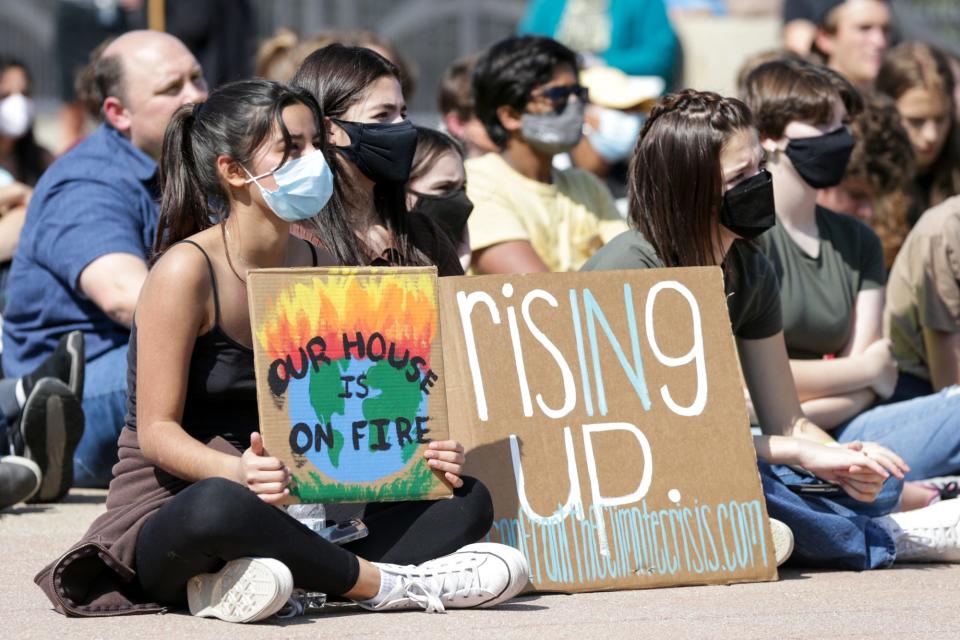 A look at the Confront the Climate Crisis rally on the John T. Myers Pedestrian Bridge, Friday, Sept. 24, 2021 in Lafayette.