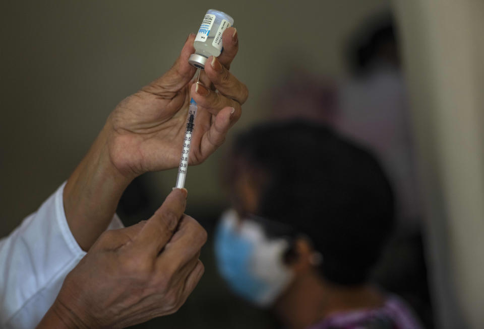 FILE - In this June 23, 2021 file photo, a nurse prepares a dose of the Cuban Abdala COVID-19 vaccine in Havana, Cuba. Cuba has been trying to rapidly roll out the two vaccines that it has approved for massive use, Abdala and Soberana, both of which require three jabs. (AP Photo/Ramon Espinosa, File)