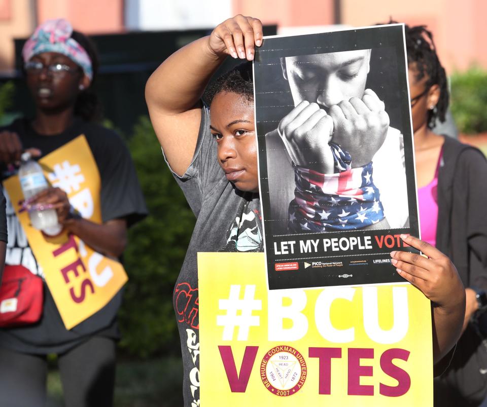 Bethune-Cookman University student Kylah Brown waits with other students on Wednesday for the start of a march from the B-CU campus to the Midtown Cultural & Educational Center to take part in early voting. Nearly six dozen students and faculty members participated in the march to shine a light on the importance of being part of the election process.