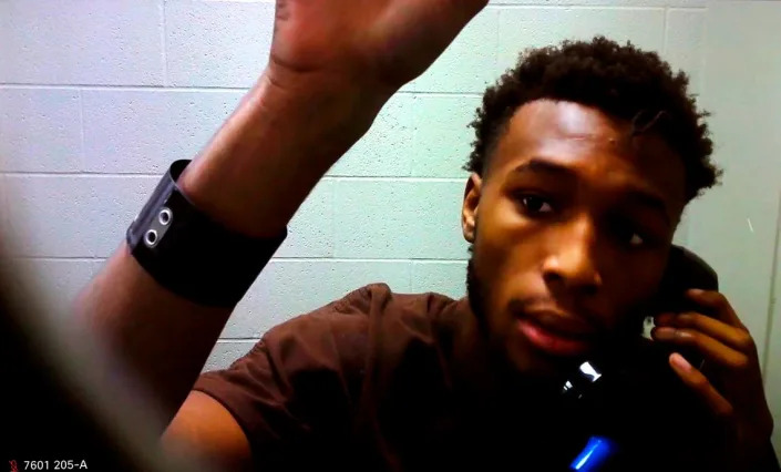 Suspect Carnell Green raises his hand to acknowledge to Court Commissioner Megan Whitmire he can see and hear the proceedings of his preliminary appearance via a video link in Benton County Superior Court. Prosecutors have charged Green with rendering criminal assistance in connection to the Oct. 15, 2022 shooting death of Jatzivy Sarabia in the area of Highway 397 and East 3rd Avenue.