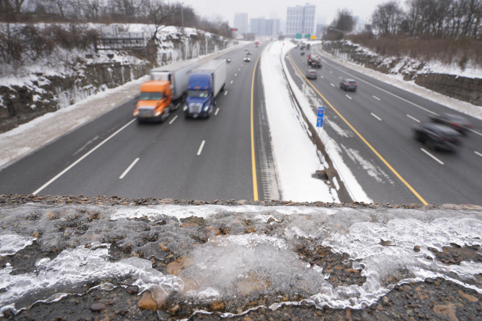 Ice is seen on an overpass above I-65 Thursday, Jan. 18, 2024, in Nashville, Tenn. A snowstorm blanketed the area with up to eight inches of snow and frigid temperatures. (AP Photo/George Walker IV)