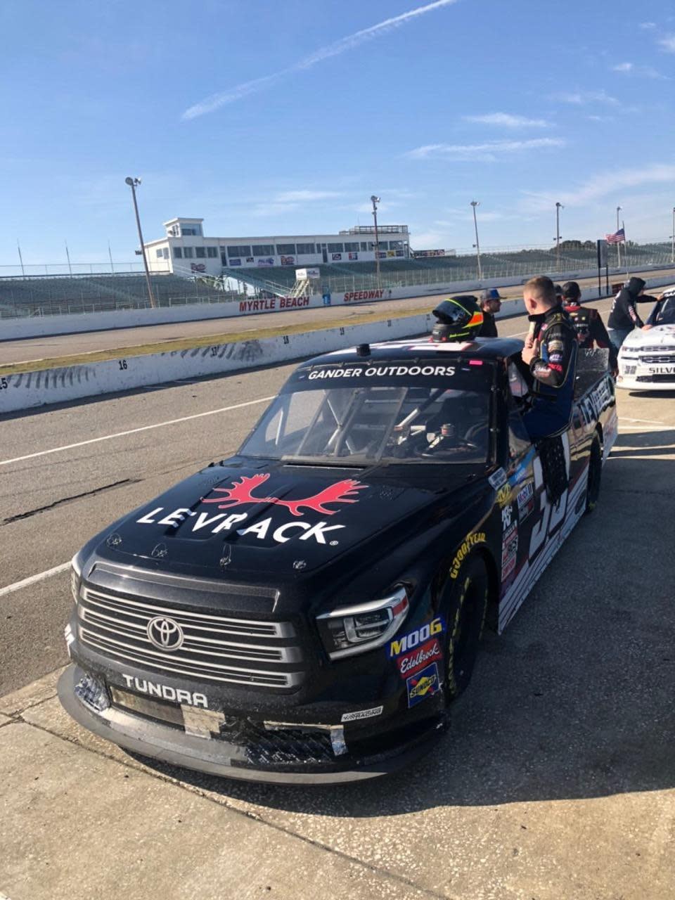 Devon Rouse of Burlington climbs into a NASCAR truck to turn a few laps in Charlotte, North Carolina.