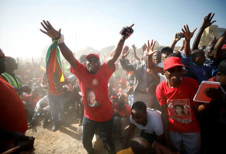 Supporters of Nelson Chamisa's opposition Movement for Democratic Change (MDC) attend the final election rally in Harare, Zimbabwe, July 28, 2018. REUTERS/Mike Hutchings