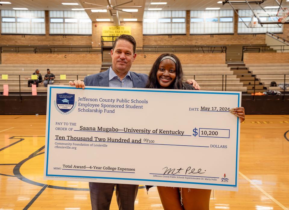 Central High School senior Saana Mugabo was presented with a scholarship check for $10,200 by JCPS Superintendent Marty Pollio on Friday morning. May 17, 2024.