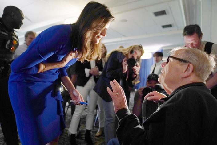 Republican presidential candidate Nikki Haley talks with Navy veteran Doug Bianchi, of Milford, N.H., during a campaign gathering, Wednesday, May 24, 2023, in Bedford, N.H.