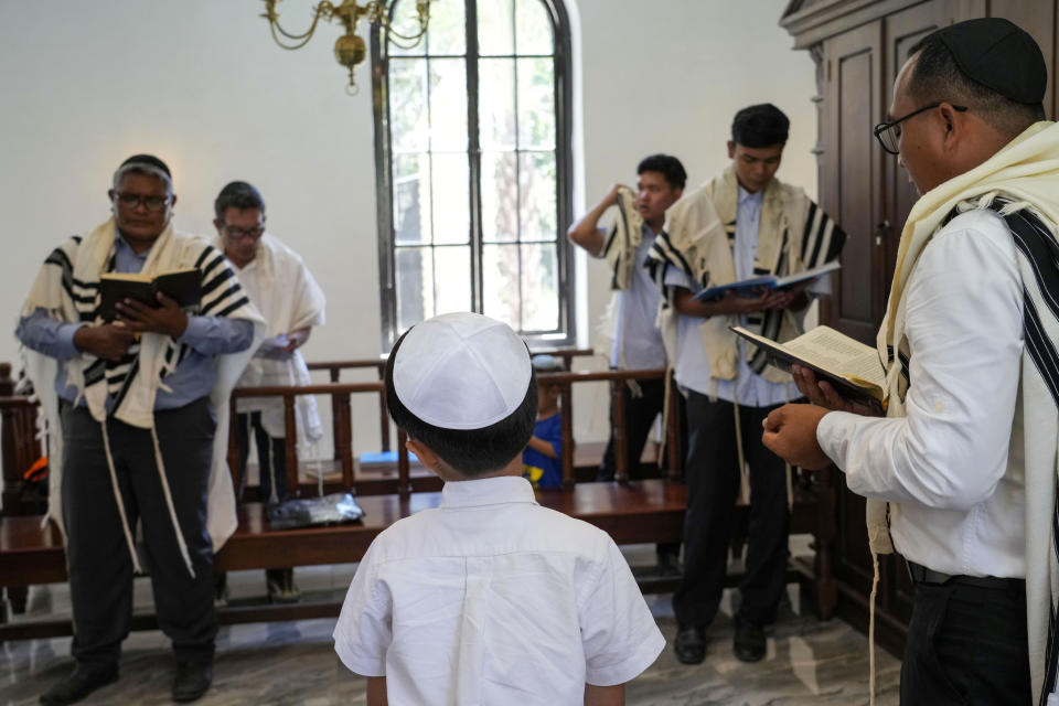 Indonesian Jews pray at Shaar Hashamayim Synagogue in Tondano, North Sulawesi, Indonesia, Saturday, Oct. 14, 2023. An Indonesian rabbi at the only synagogue in the world's most populous Muslim-majority nation, called on Saturday for peace and an an end to the fightings in Israel and Gaza. (AP Photo/Tatan Syuflana)