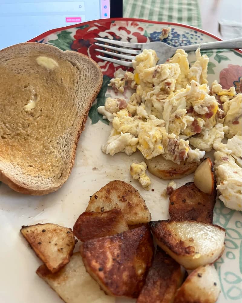eggs, toast and potatoes on plate