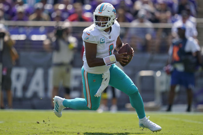 Miami Dolphins quarterback Tua Tagovailoa (1) looks to throw a pass during the first half of an NFL football game against the Baltimore Ravens, Sunday, Sept. 18, 2022, in Baltimore. (AP Photo/Julio Cortez)