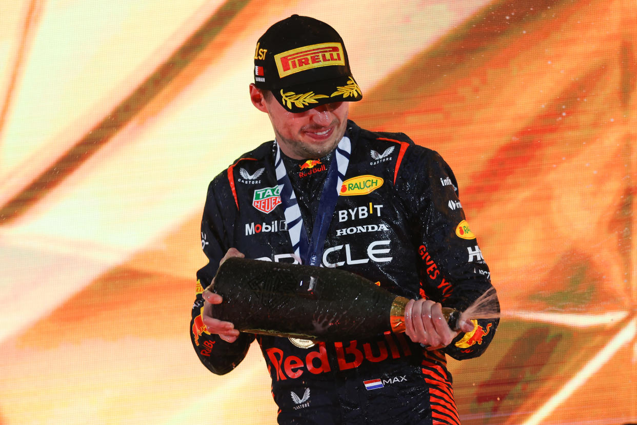 BAHRAIN, BAHRAIN - MARCH 05: Max Verstappen of Netherland and Oracle Red Bull Racing celebrating on the podium during the F1 Grand Prix of Bahrain at Bahrain International Circuit on March 05, 2023 in Bahrain, Bahrain. (Photo by Eric Alonso/Getty Images)