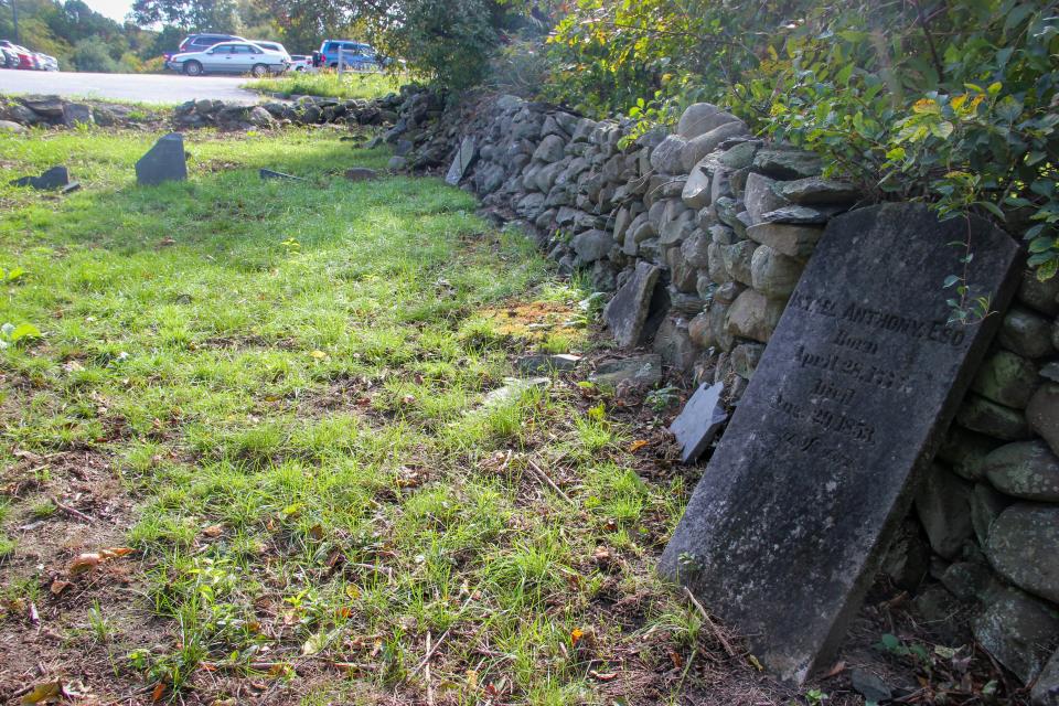 The gravestone of Israel Anthony leans against a stone wall at John Anthony Cemetery in Somerset off Route 103.