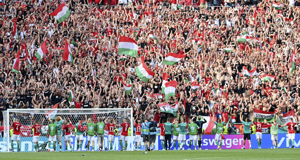 Hungary's players celebrate with their fans after the Euro 2020 soccer championship group F match between Hungary and France at the Ferenc Puskas stadium in Budapest, Hungary Saturday, June 19, 2021. (Tibor Illyes/Pool via AP)