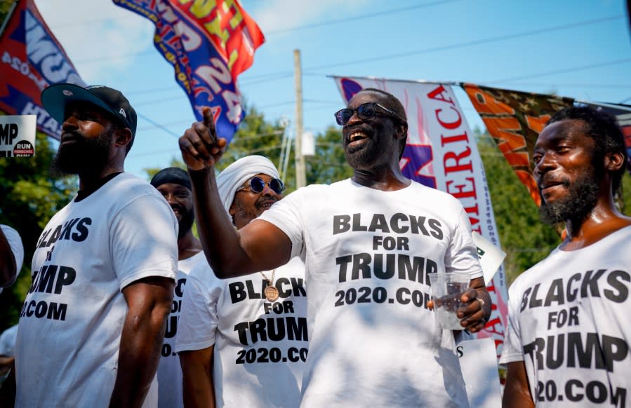 Blacks For Trump members gather on Rice Street on Aug. 24, 2023, to support the former president in Atlanta. (Photo by Benjamin Hendren/Anadolu Agency via Getty Images)