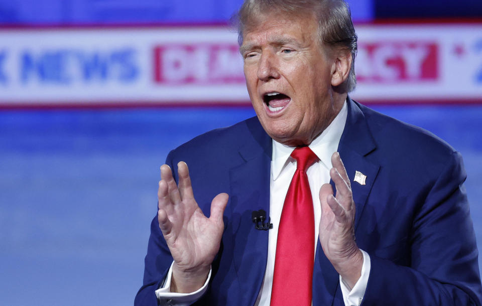 Former President and 2024 Republican presidential frontrunner Donald Trump gestures as he speaks during a town hall in Des Moines, Iowa, on night of Jan. 10, 2024. / Credit: KAMIL KRZACZYNSKI / AFP via Getty Images