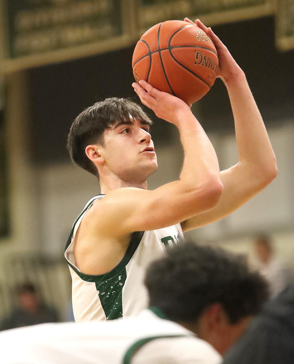 Rice's Drew Bessette keeps his eye on the rim while shooting a free throw during the Green Knight's 79-64 win over St Johnsbury on Thursday night at RHS.