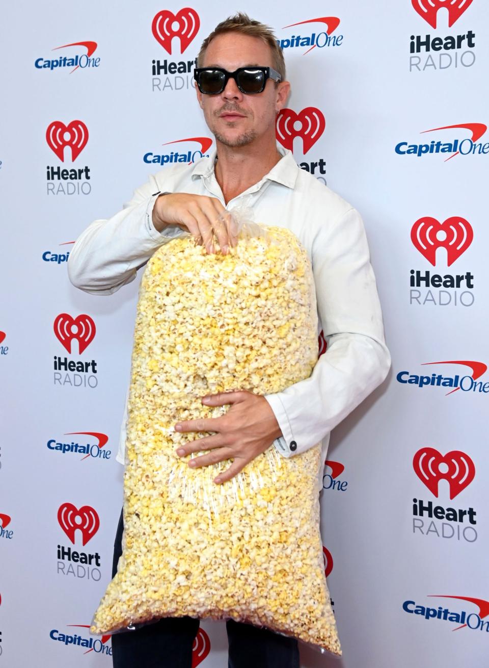<p>Diplo (with his popcorn!) arrives at the 2022 iHeartRadio Music Festival at the T-Mobile Arena on Sept. 23 in Las Vegas.</p>