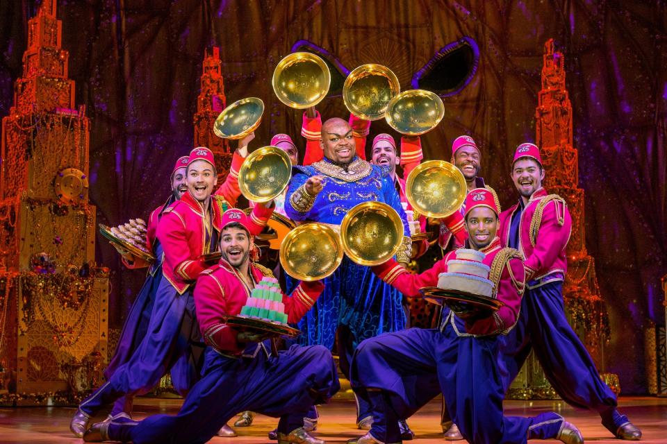 Marcus M. Martin, center, as Genie, and members of the company perform a scene from the national touring production of "Disney's Aladdin," which American Theatre Guild will present March 19 to 24, 2024, at the Morris Performing Arts Center in South Bend.