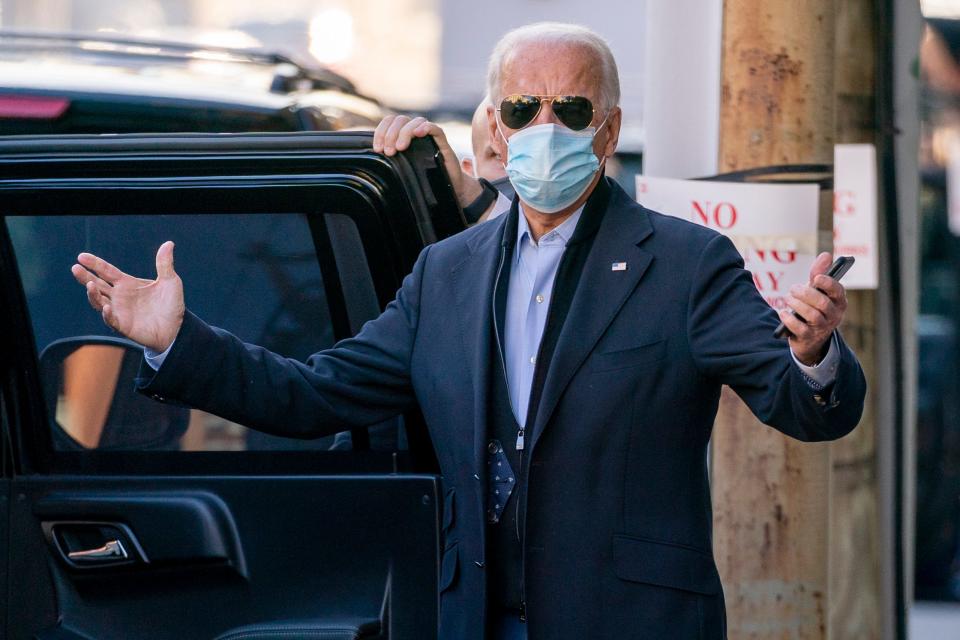 President-elect Joe Biden speaks to reporters as he leaves The Queen theater on Nov. 18, 2020, in Wilmington, Del.