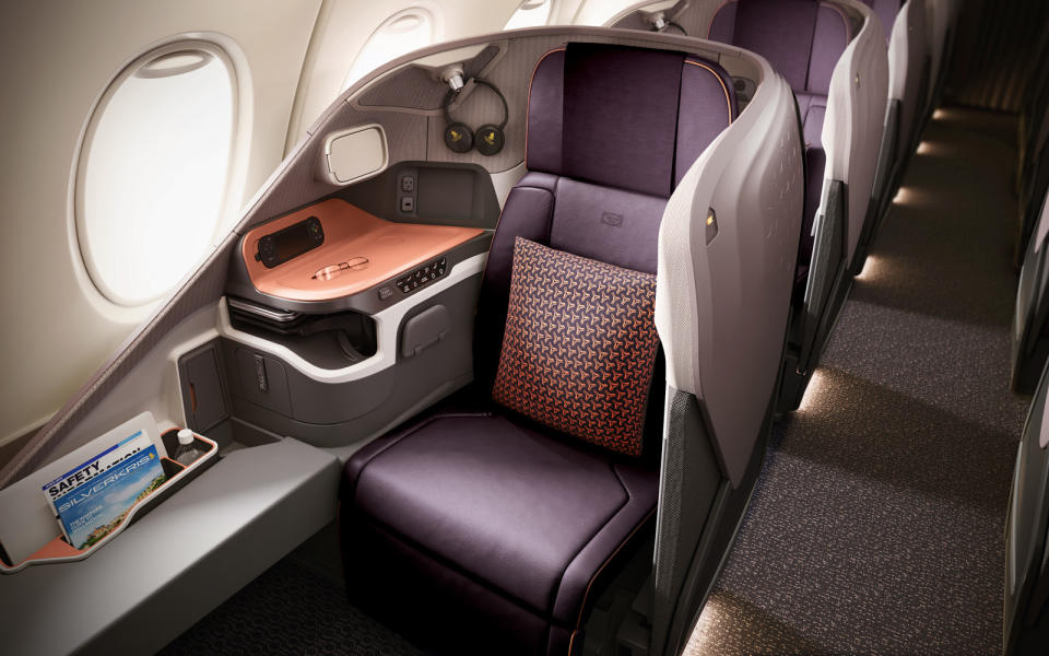 <p>The new A380 cabins debut a new <a rel="nofollow noopener" href="https://youtu.be/OW-3sL1ul3g" target="_blank" data-ylk="slk:demi-suite business class;elm:context_link;itc:0;sec:content-canvas" class="link ">demi-suite business class</a>, which we would describe more as a bleisure class cabin. It was designed by JPA Design and manufactured by JAMCO Corporation of Japan.</p> <p>The design blends modern lines with an organic color scheme with leather and fabric trim, and carbon composite shells. This blend of futurism and nature reflects the character of Singapore, with its gleaming skyscrapers and historical buildings, all enveloped by the sea and a lush tropical landscape.</p> <p>“We looked to Garden City of Singapore itself, its connection with nature and its bio sensitive design as our inspiration in creating the business class seat and cabin,” said John Tighe, design director at JPA Design, who lead the program for the new Singapore Airlines business class cabin product. “We wanted customers to be delighted by a warm and modern ambience.”</p> <p>The 78 seats are all forward-facing, in a 1-2-1 configuration with direct aisle access for every passenger. Each seat is 25 inches wide and has two side wings for better back support. For those who want to get down to work in-flight, the seat includes a dedicated business panel with USB ports and in-seat power, reading lights with adjustable brightness level, personal mood lighting, and a large table which easily converts from desk to dining. There is also plenty of stowage space for personal items within easy reach.</p>