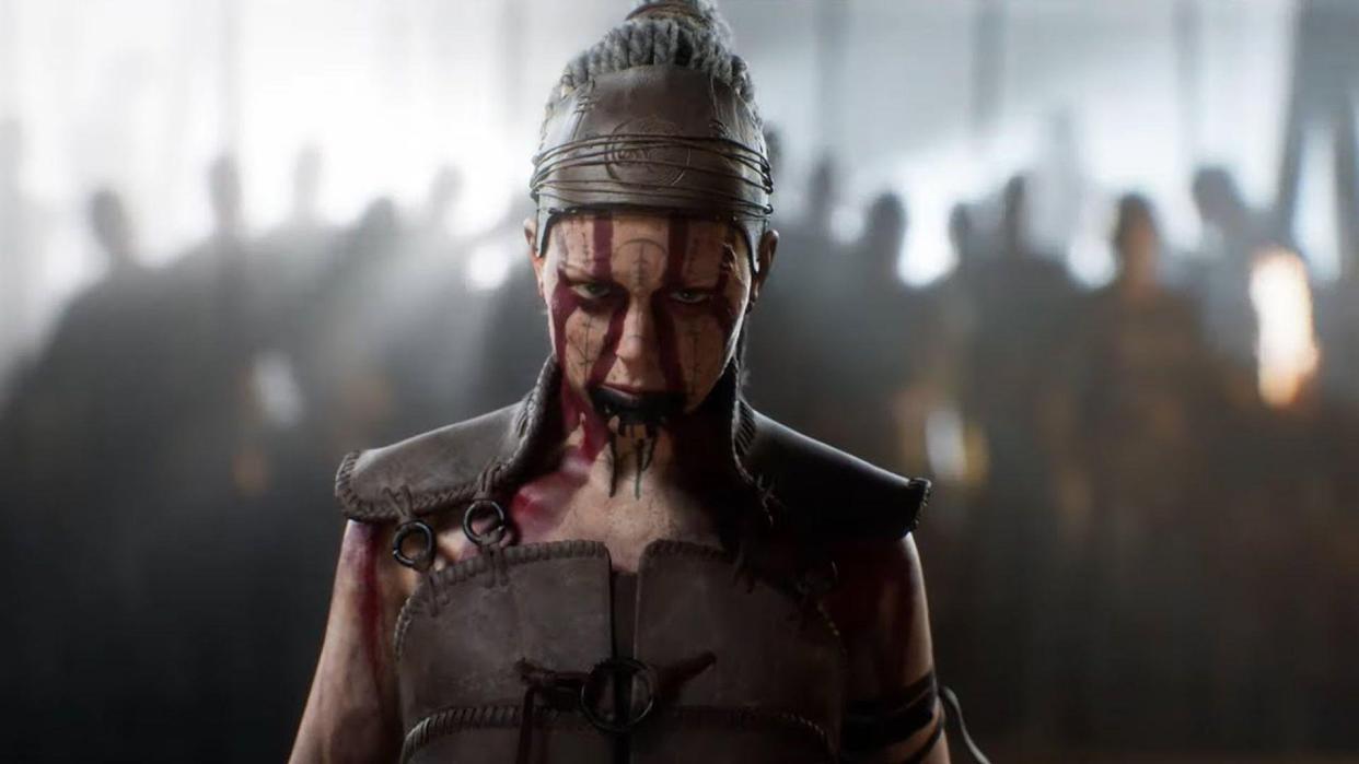  Senua stands in front of an army, wearing blood red face paint. 