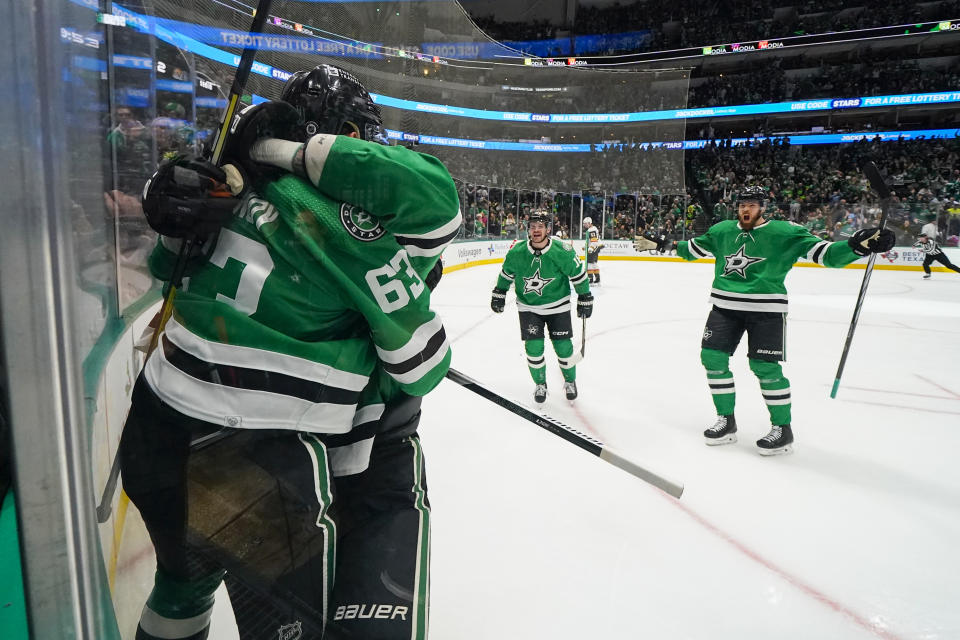 Dallas Stars right wing Evgenii Dadonov (63) celebrates his first period goal with teammates during an NHL hockey game against the Vegas Golden Knights, Saturday, Dec. 9, 2023, in Dallas. (AP Photo/Julio Cortez)