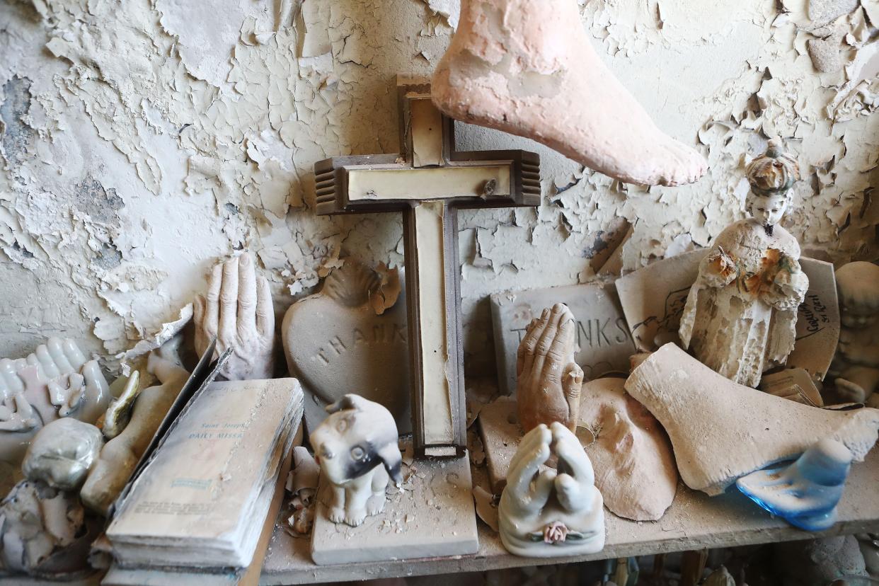 Offerings are viewed during renovations in St. Roch Chapel, dedicated in 1865, on April 16, 2018 in New Orleans, Louisiana.