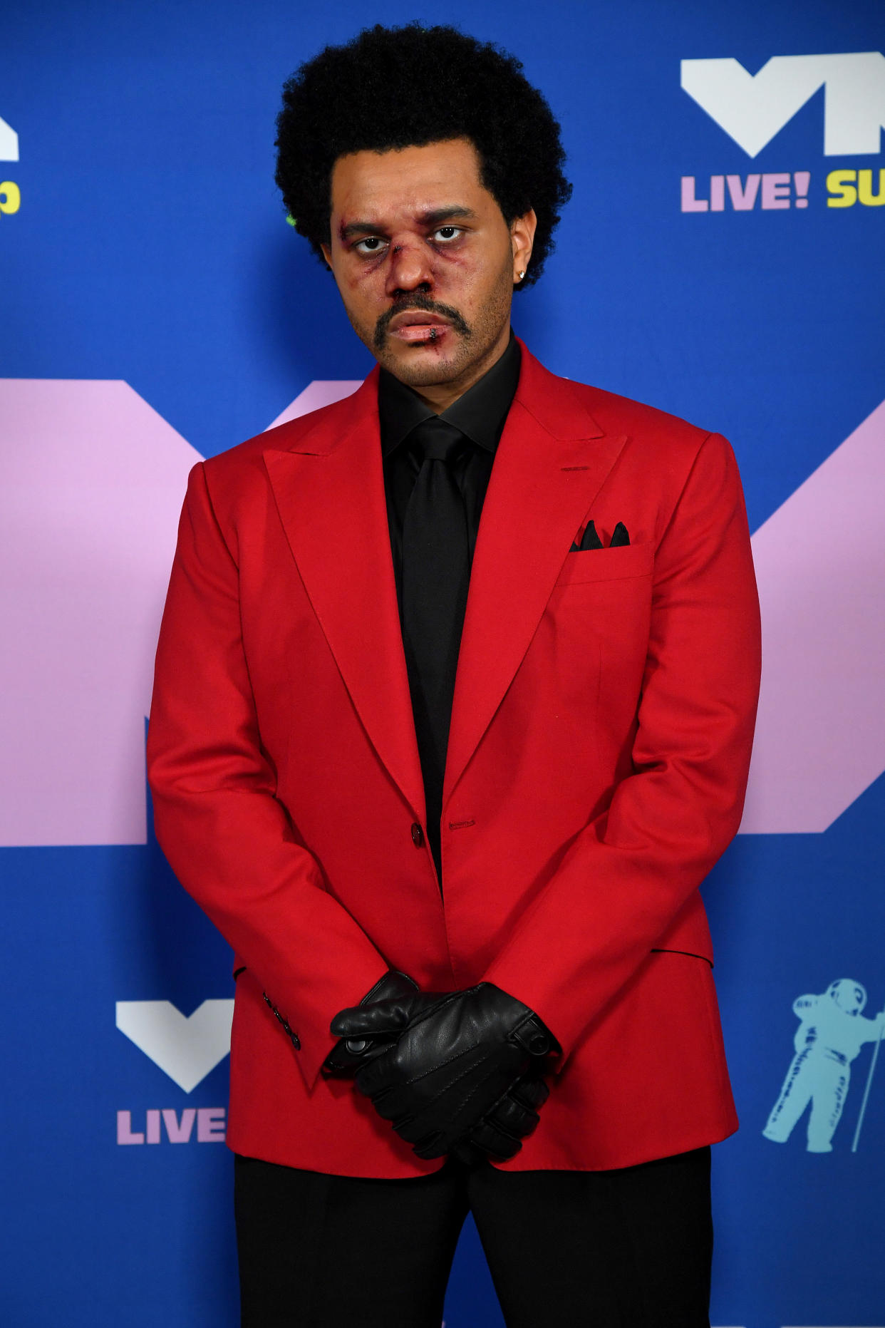 The Weeknd poses with bloodied face at the 2020 MTV Video Music Awards