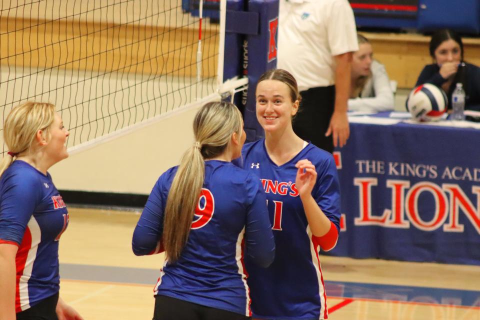 Junior outside hitter Kelly Kinney, a Minnesota commit, celebrates a point with a teammate during her 19-kill region semifinal performance at King’s Academy on Friday, Oct. 27, 2023.