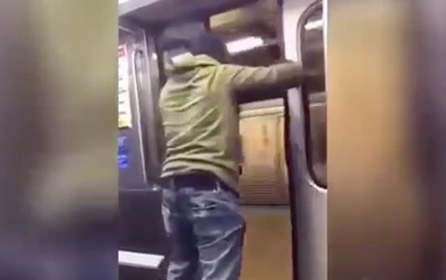 The man opens the doors as the train pulls up to a platform. Source:Queshabaybae