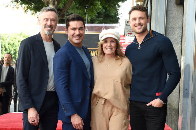<p>Gilbert Flores/Variety via Getty</p> Zac Efron (second from left) poses with David Efron, Starla Baskett and Dylan Efron on Dec. 11, 2023