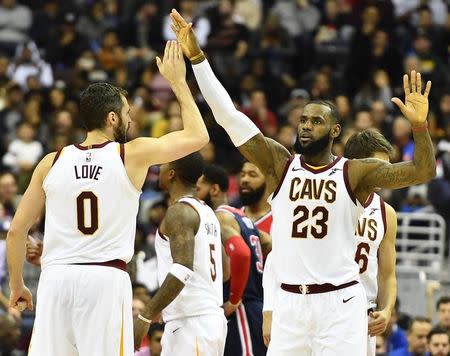 Dec 17, 2017; Washington, DC, USA; Cleveland Cavaliers forward LeBron James (23) celebrates with forward Kevin Love (0) against the Washington Wizards during the second half at Capital One Arena. Mandatory Credit: Brad Mills-USA TODAY Sports