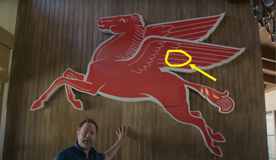 A massive pegasus from Mobil Gas hanging in Rainn Wilson's home