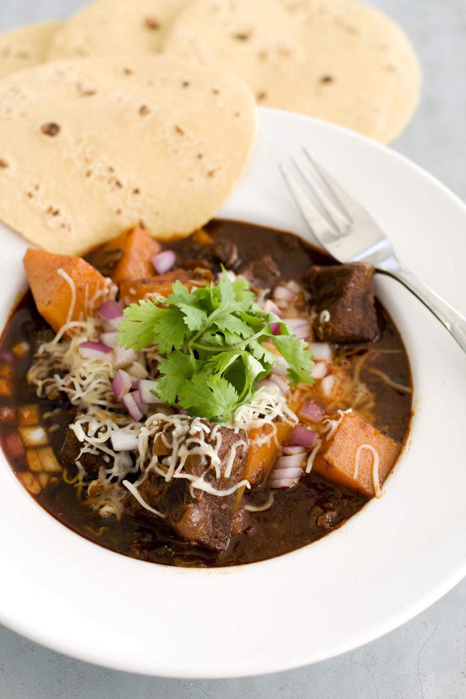 In this image taken on January 7, 2013, Mexican beef brisket and winter squash chili is shown served in a bowl in Concord, N.H. (AP Photo/Matthew Mead)