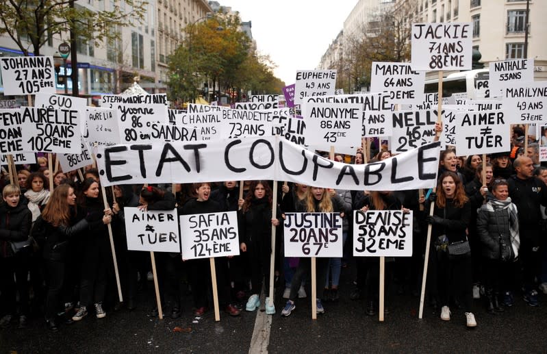 People attend a demonstration to protest femicide and violence against women in Paris