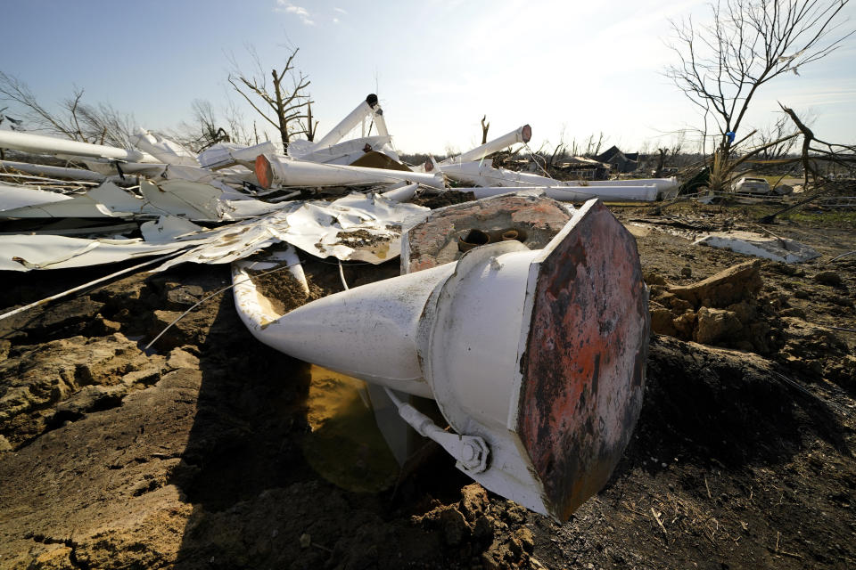 The remains of the town water tower lies in ruin in the aftermath of tornadoes that tore through the region, in Mayfield, Ky., Tuesday, Dec. 14, 2021. (AP Photo/Gerald Herbert)