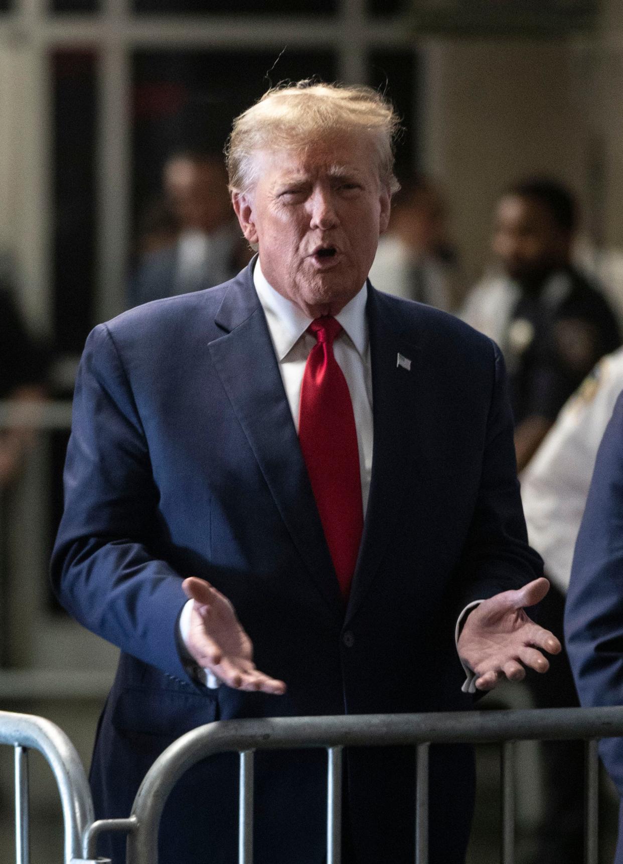 Former President Donald Trump speaks to the media in the Manhattan Criminal Courthouse Feb. 15, 2024 before a procedural hearing ahead of his trial over a hush money payment to an adult film star before the 2016 election.